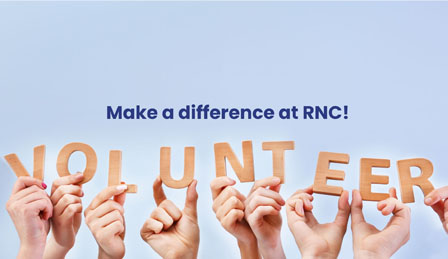 a close up of hands holding letters to which make up the word 'volunteers'. Text reads: Make a difference at RNC!